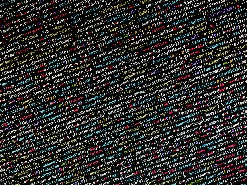A computer monitor displaying a close-up view of a code editor with a dark background, showcasing a webpage's HTML structure. Visible code lines include the document type declaration, the opening html
